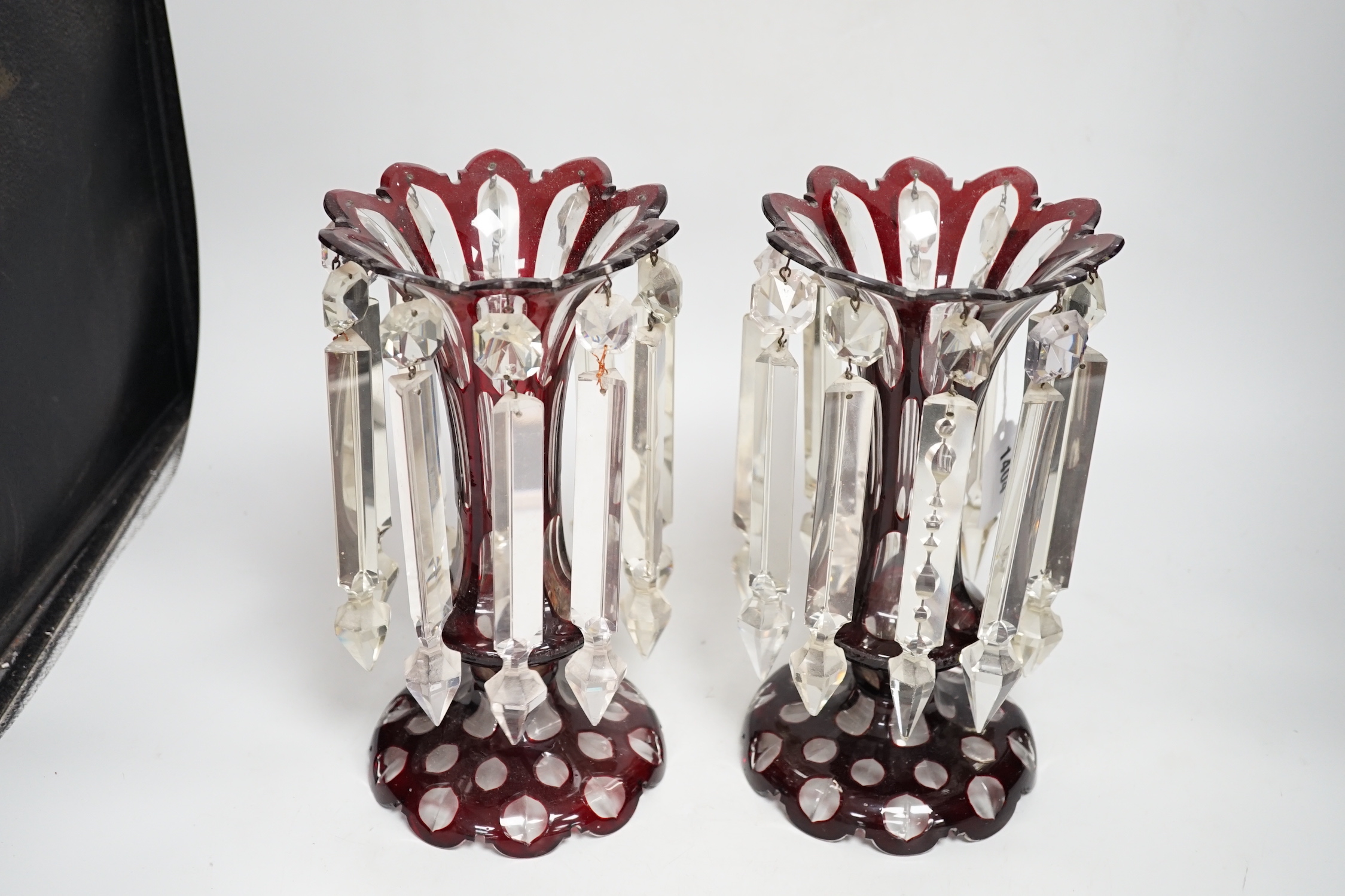 A pair of Victorian ruby overlaid glass table lustres, 28cm